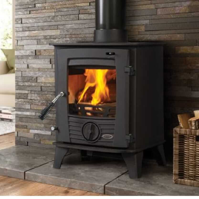 Henley Druid 5kW Freestanding Stove in a stone effect setting with a warming fire
